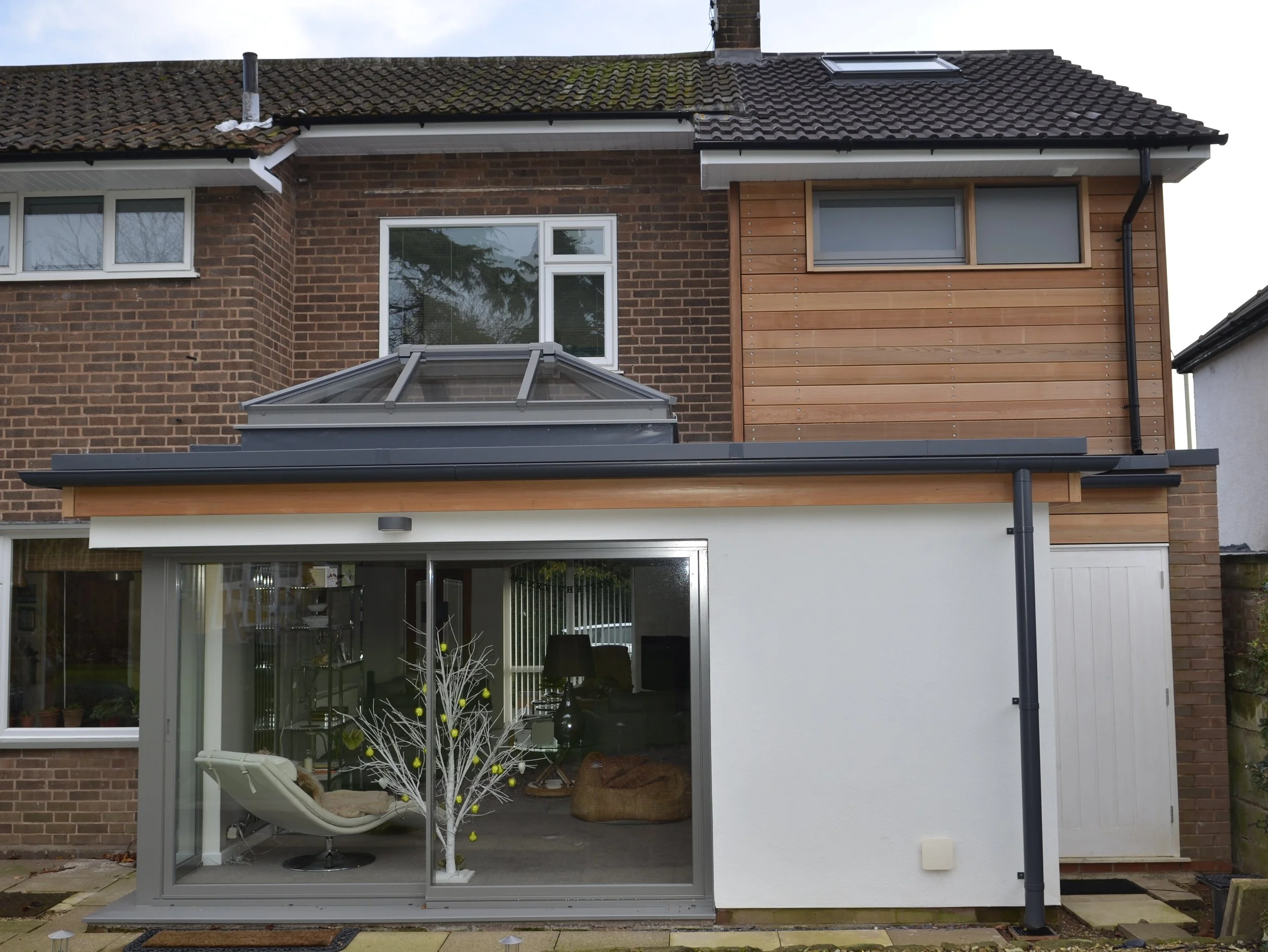 cedar clad side first floor extensions with updates to front and rear elevations in Halesowen, West Midlands