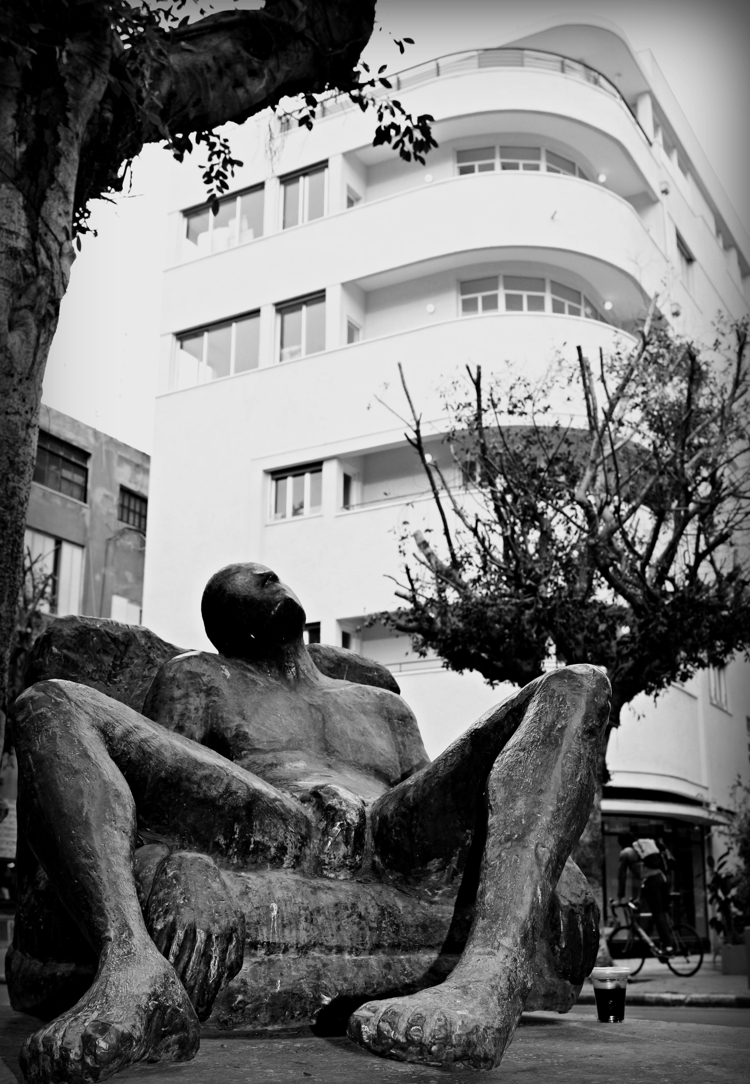 A Male Statue & Bauhaus Style Building