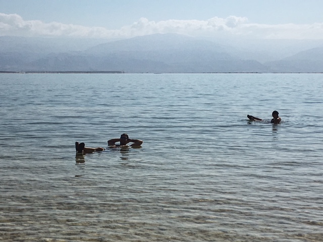 My husband and friend bobbing in the Dead Sea