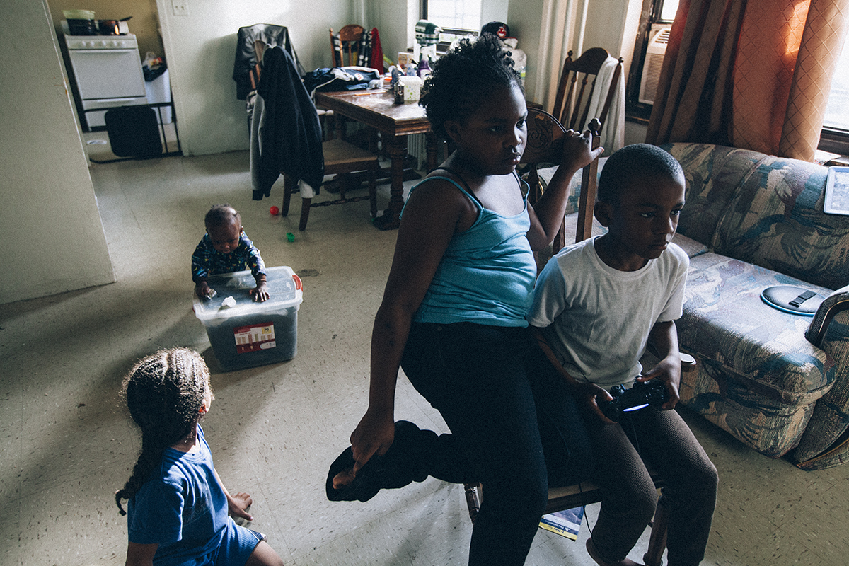 House McJunkin features the Kelvin McJunkin, his friends and family in the public housing complex, Boulevard Houses, in East New York, NY.