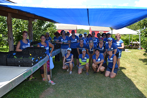 The Capitol Women's Network volunteer group for the morning of service at the Inter-Faith Food Shuttle Teaching Farm AFTER finishing their work on Thursday, July 13, 2017.