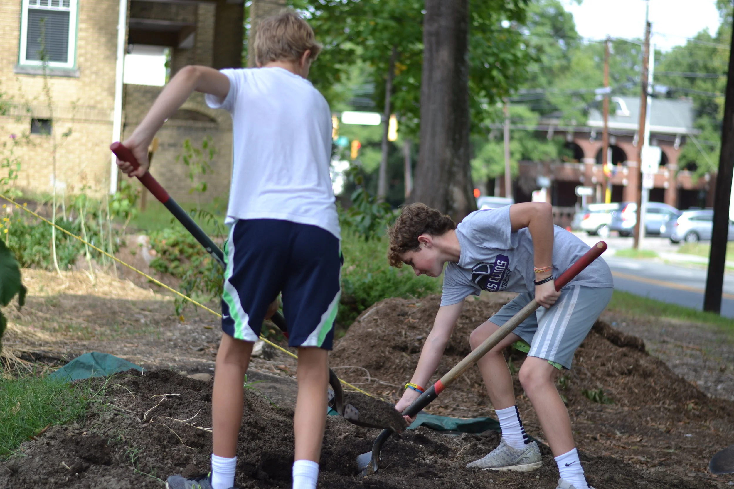 Durham Academy students work at the Geer Street Learning Garden
