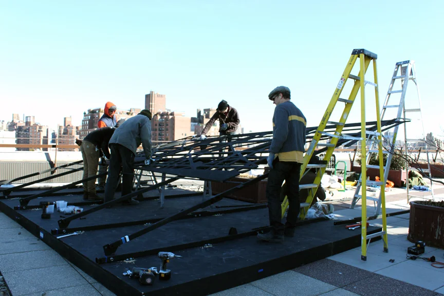 The DCM Fabrication team installing the piece on-site. 
