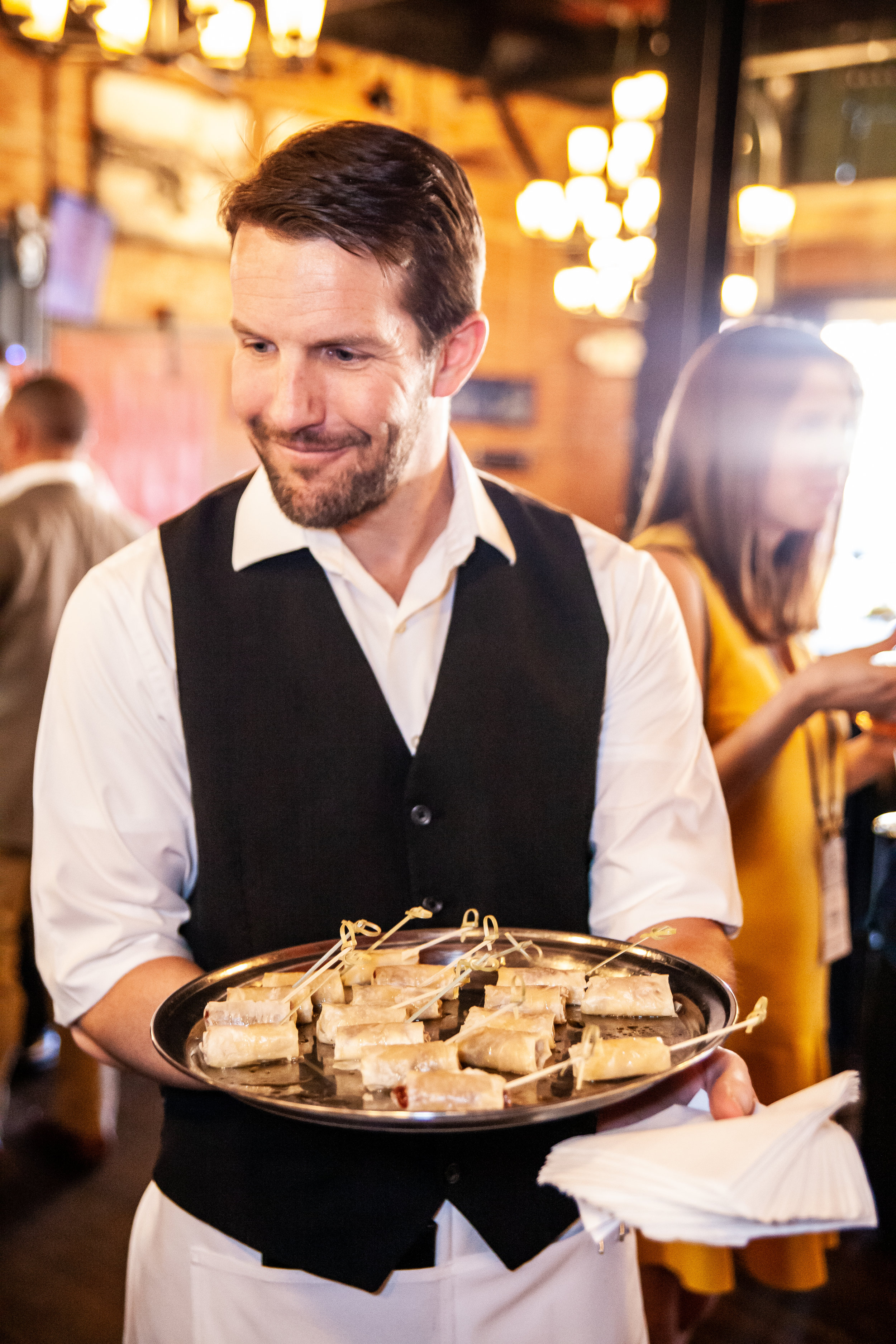 Waiter delivering appetizers