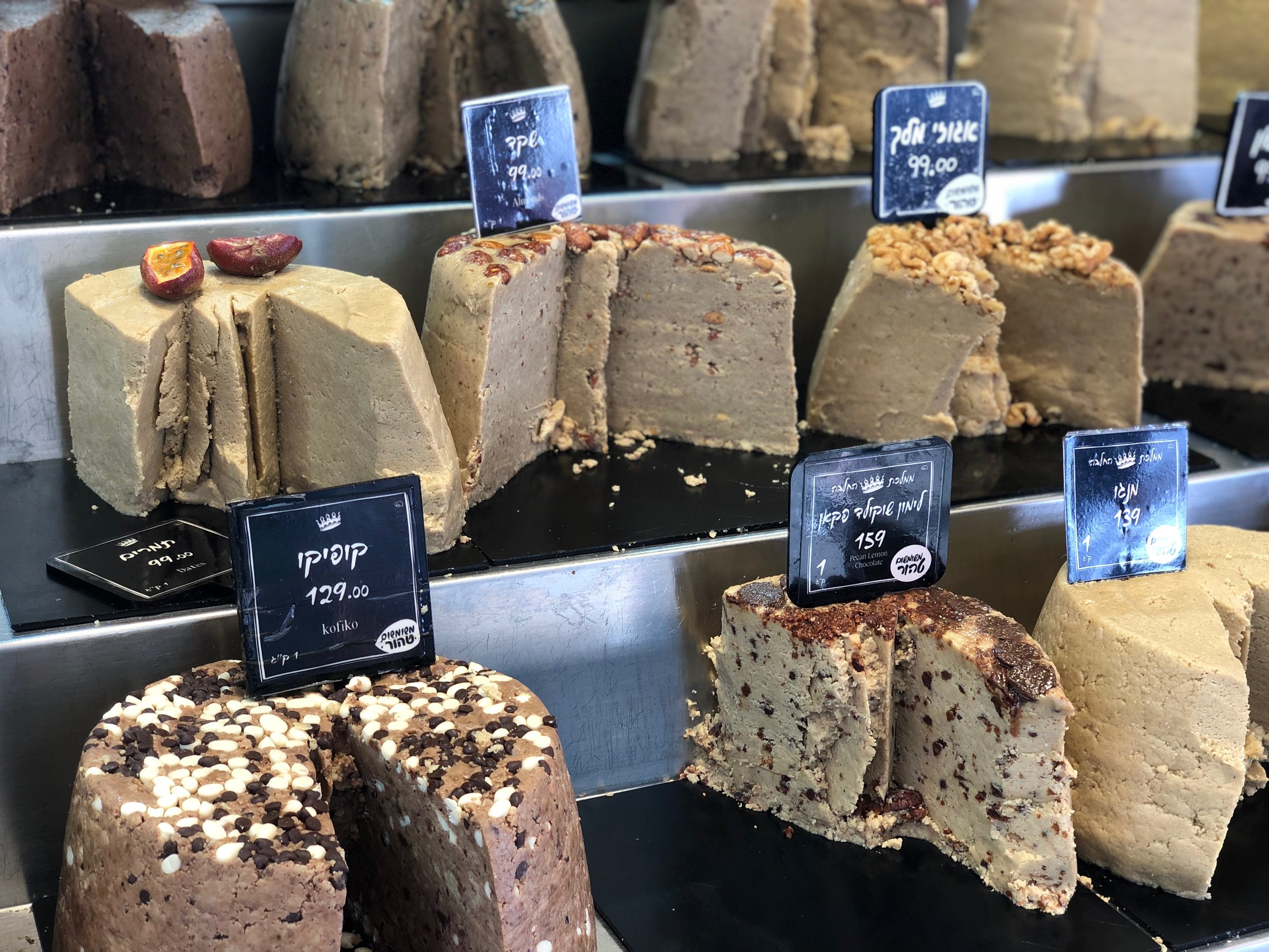Halvah cakes ready to be sampled and sliced at the Carmel Market in Tel Aviv