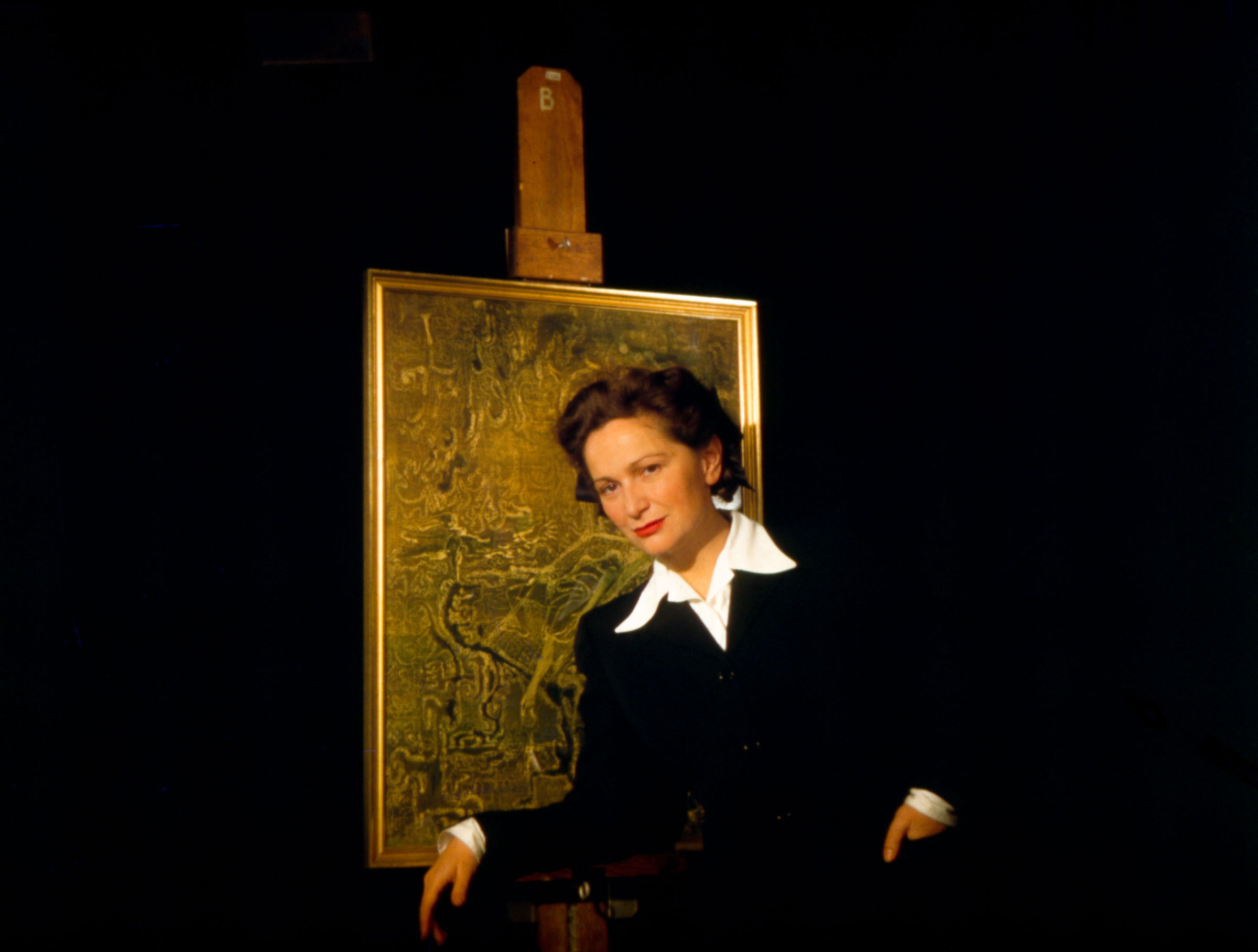 Hedda Sterne with her painting, c. 1943
