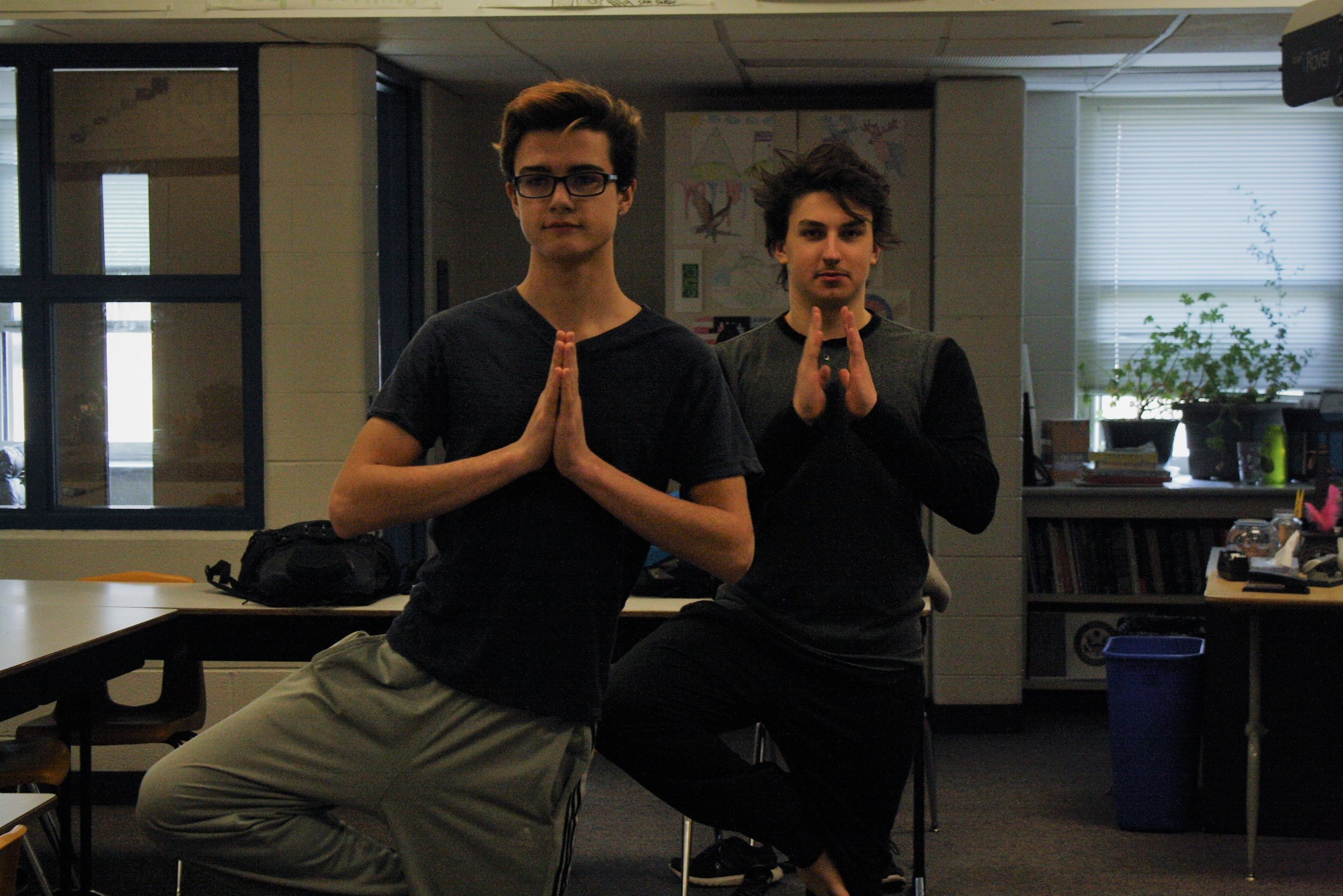 students doing yoga poses