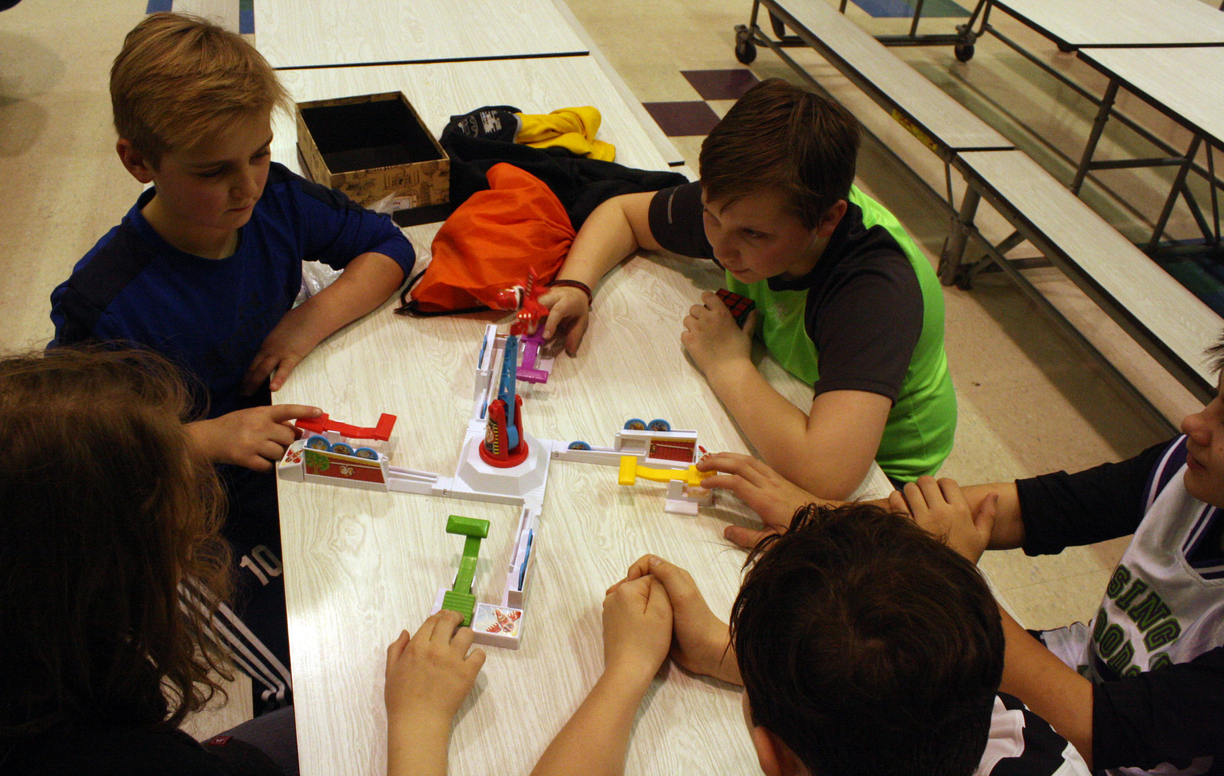 students playing board game