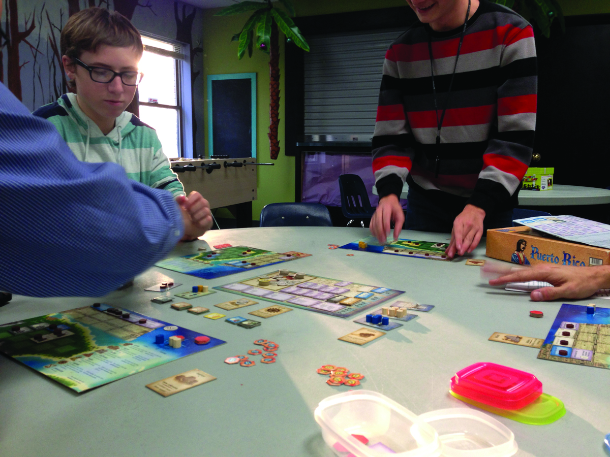 students playing board game