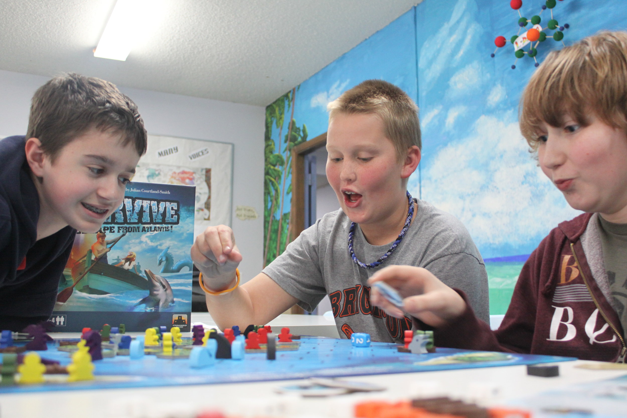 students playing board game