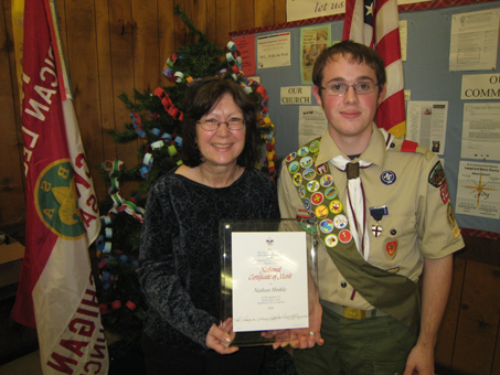 Suzanne Gordon, left, found herself trapped in a flooding car after an accident on County Road D-19 last February until Nathan Hinkle, right, came along to help. Hinkle has received a national certificate of merit from the Boy Scouts of America. (PHOTO COURTESY, PINCKNEY BOY SCOUT TROOP NO. 312)