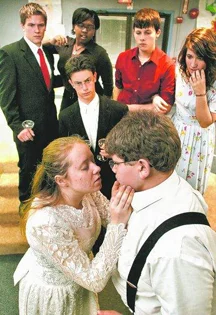 The Kensington Woods High School drama club presents "Prelude to a Kiss." Front left: Abbi Hittel as Rita, Brad DiGiamberardino as The Old Man. Center: Nick German as Peter. Back left: Josh McGahey as Uncle Fred, Erica Phillips as Aunt Dorothy, Jimmy Valentine as Dr. Marshall Boyle and Eryca Cottle as Mrs. Boyle. (Photo by ALAN WARD/DAILY PRESS & ARGUS)