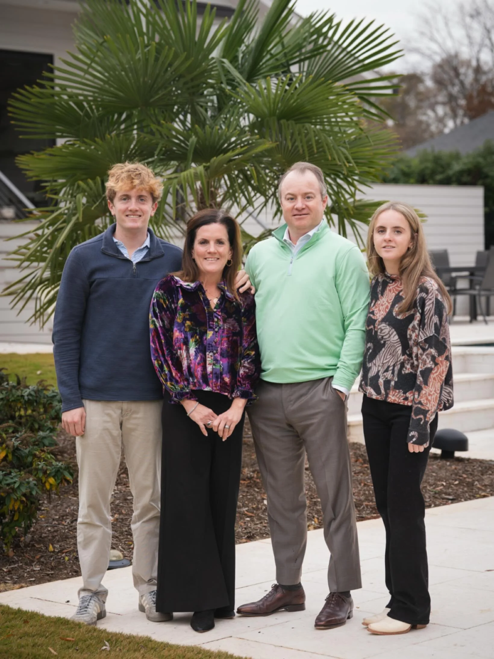 A backyard oasis family photo. 🌴☀️
