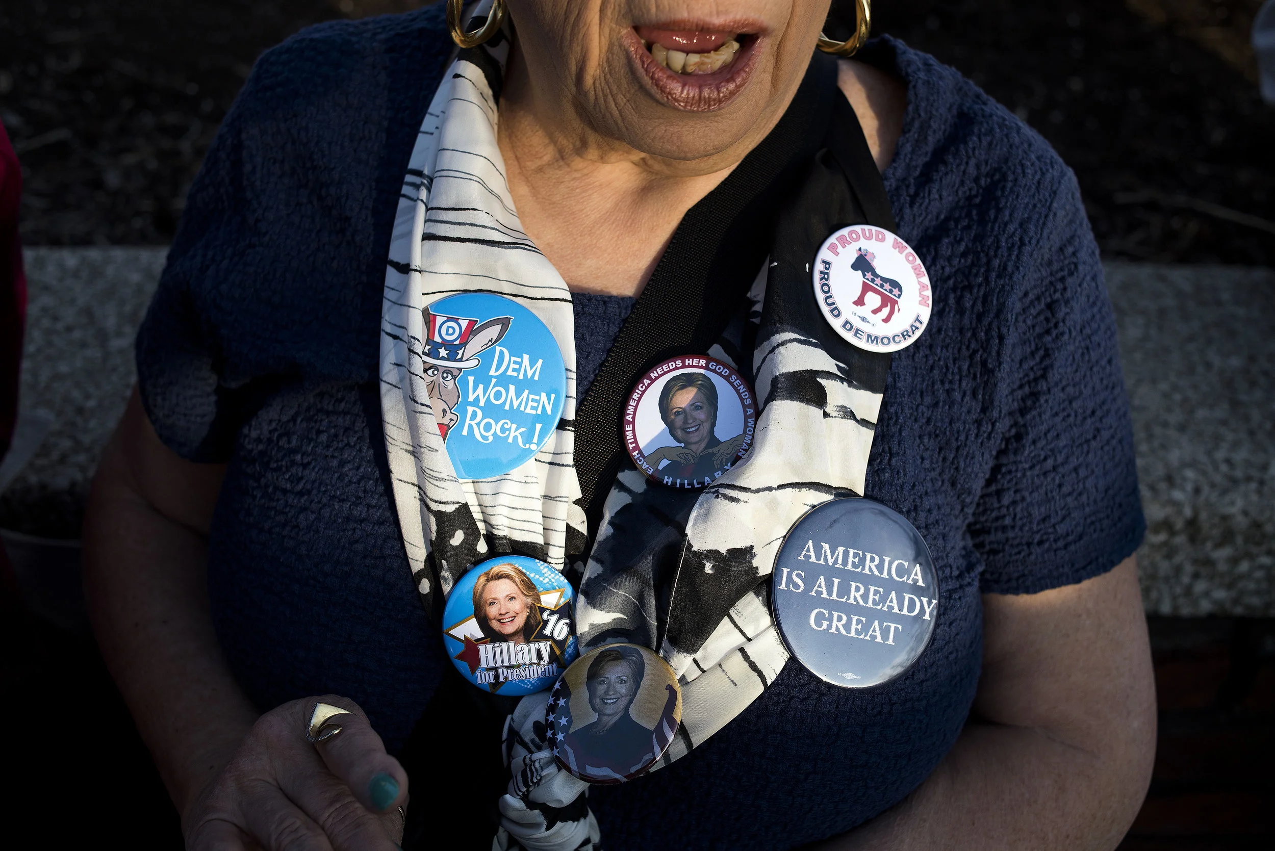 A Hillary supporter displays her memorabilia while waiting in line before the start of a campaign event for Democratic presidential candidate Hillary Clinton, at Cuyahoga Community College, on Tuesday, March 8, 2016 in Cleveland, Ohio.