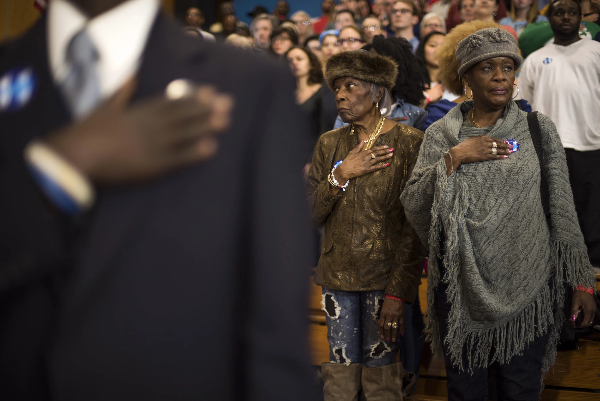 Attendees stand for the Pledge of Allegiance during a campaign event for Democratic presidential candidate Hillary Clinton, on March 8, 2016 in Cleveland, Ohio.
