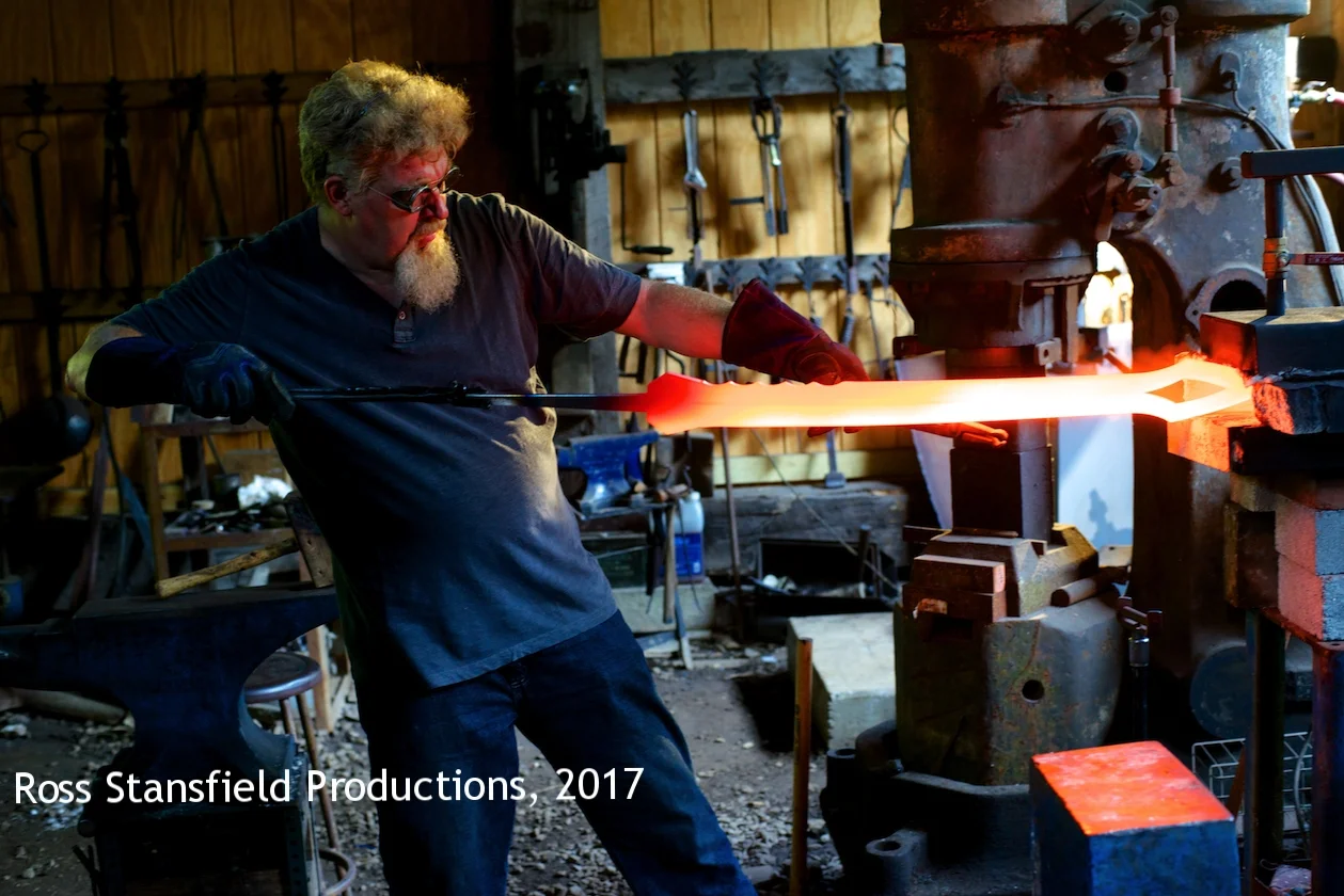 Kerry Stagmer pulls Iron Man's sword from the forge