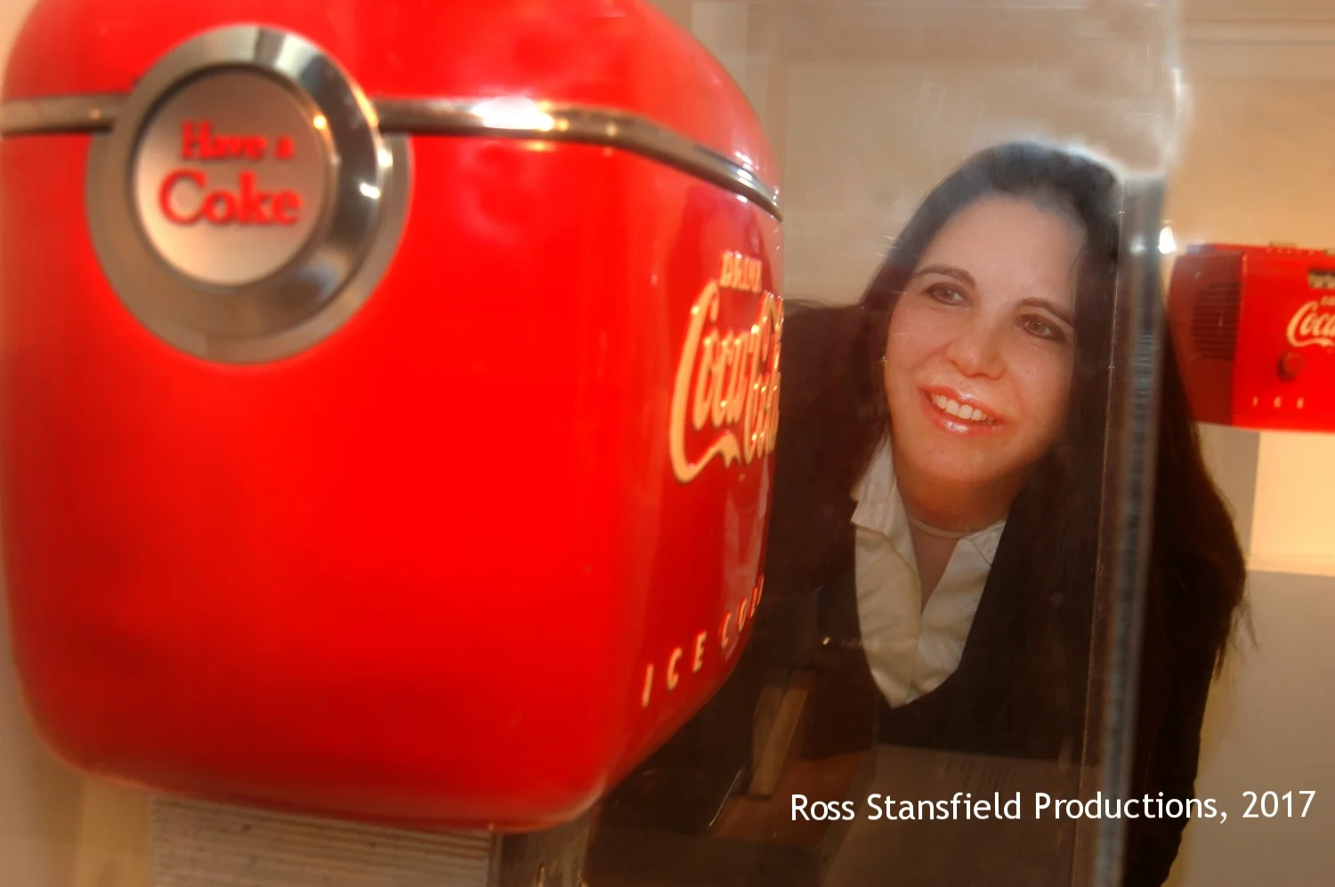 Laurence Loewy regards the Dole dispenser for Coca Cola