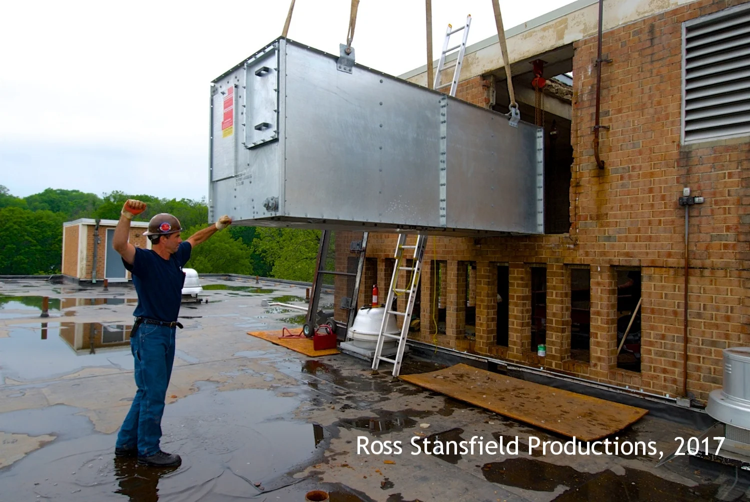 ACI installing an AC Chiller on the roof.