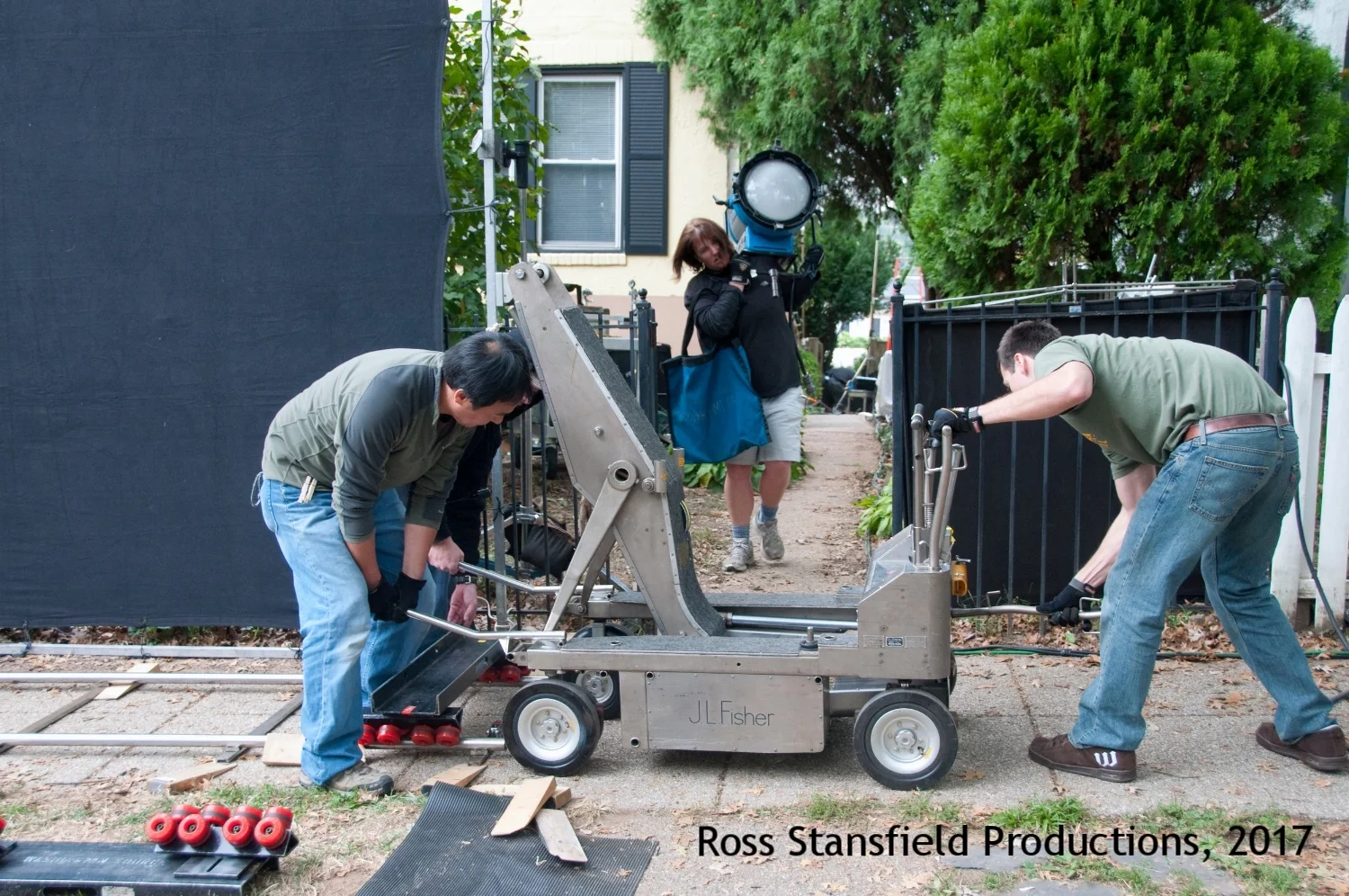 Louise brings a 4 K as Fisher dolly is readied.