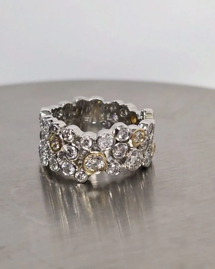 Platinum and yellow gold mixed sized diamond "Bubble" band. 
This was a fun project, taking all of my clients old, unworn items apart and redesigning them into a modern wearable piece of art. It came together very organically. 

#diamondban