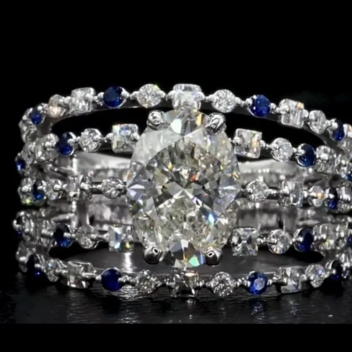 From a CAD design to a stunningly made diamond and sapphire ring to a happily engaged couple...what could be better. So happy I could design and make this for them!
18k white gold ring with a 1.5ct oval diamond center, accented with round diamonds, B