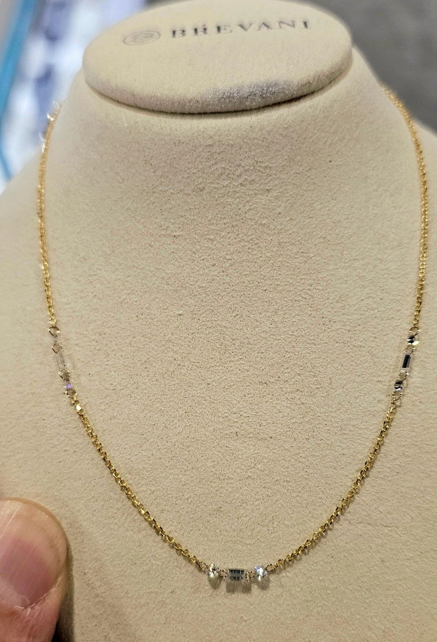 I have walked miles a day throughout the show and have found lots wonderful pieces to share. This one is just a sweetheart little necklace...everyday, simple amd elegant. Love his little bobble