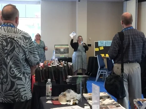 Attendees could complete a passport by visiting each vendor table. Completed passports were entered into a number of drawings for prizes from vendors. Photo by Anne Marie Lyons