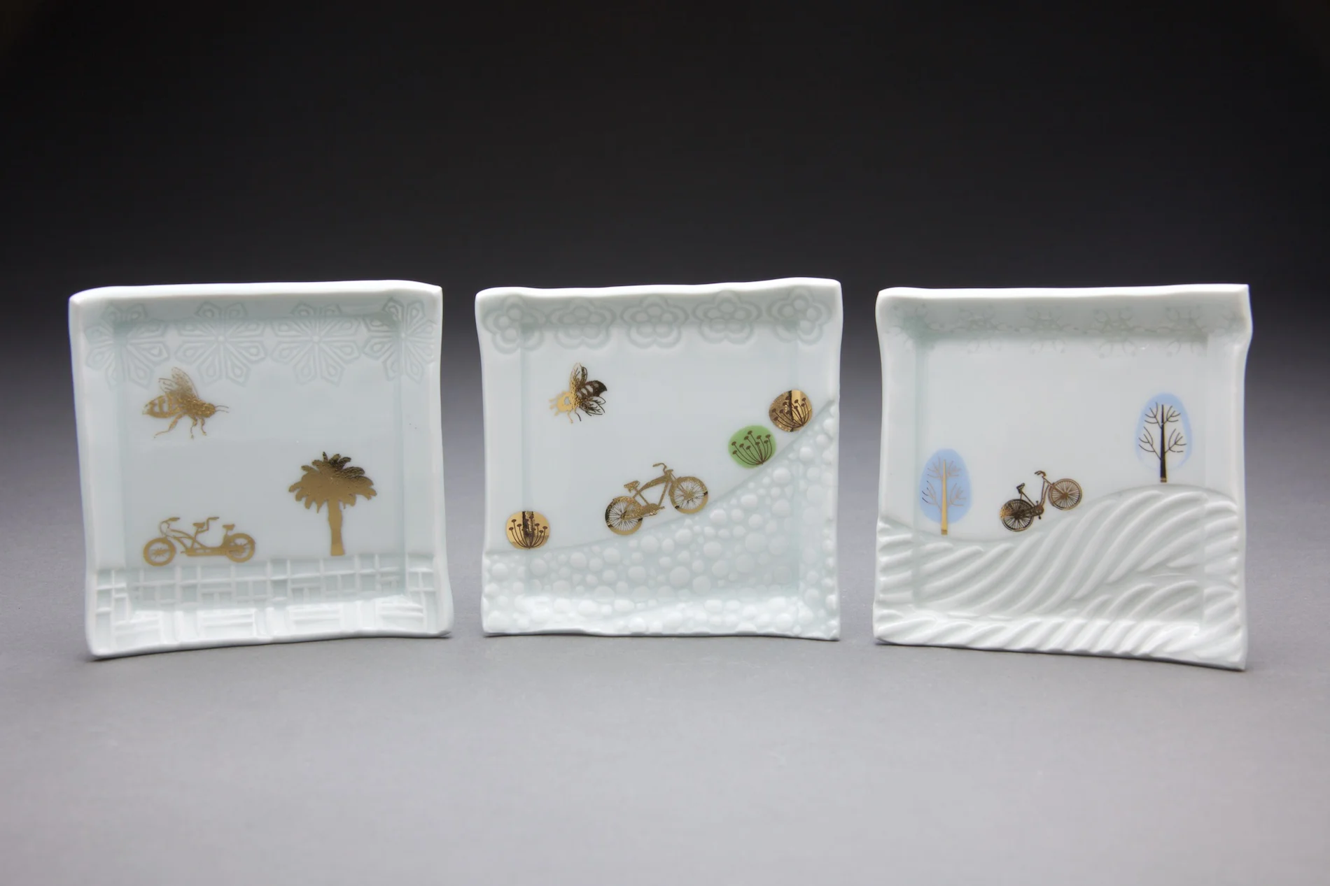 Each tray is 4x4in with clear glaze and gold decals.