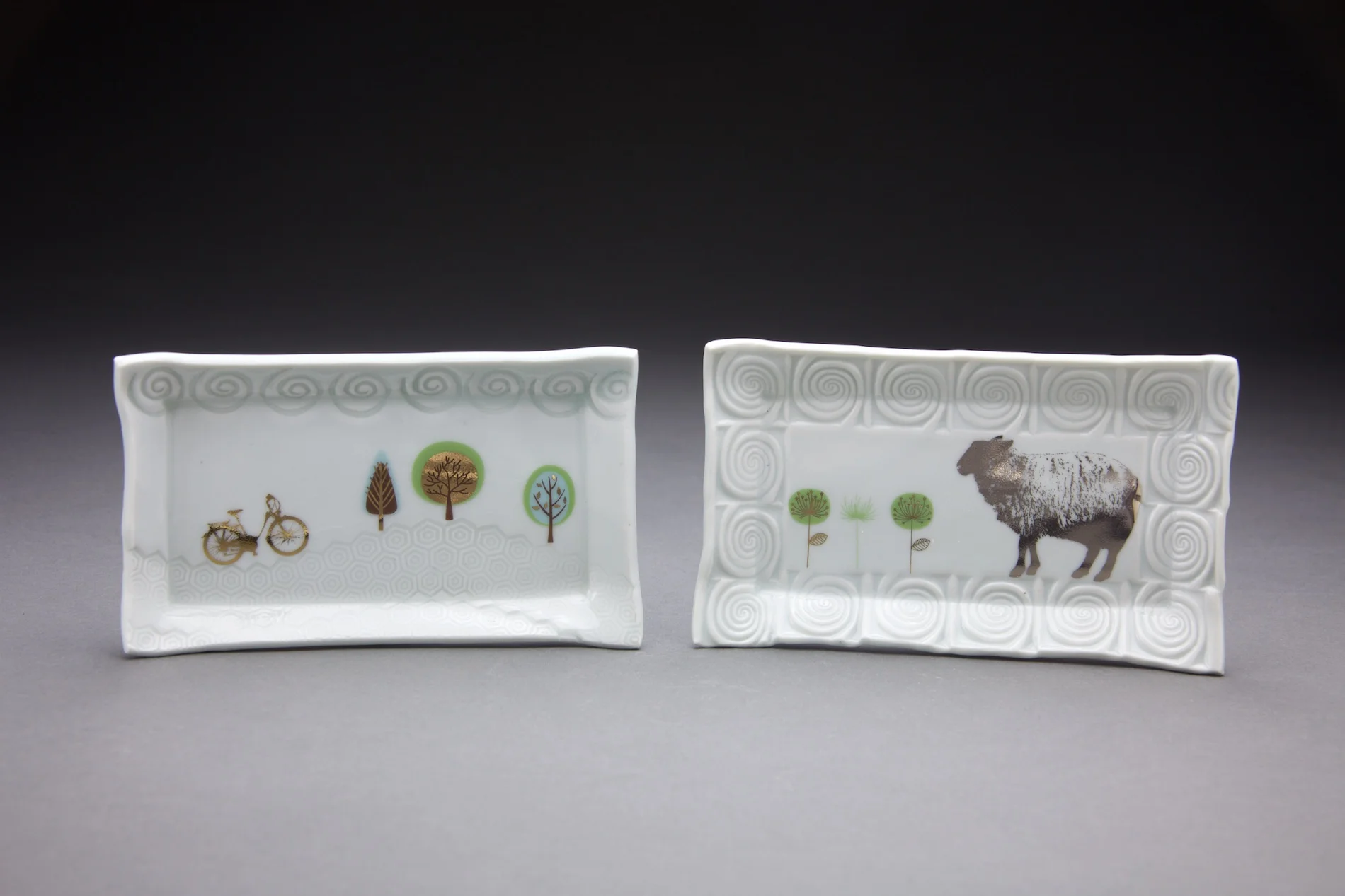 Each tray is 3x6in.clear glaze with gold & platinum decals.