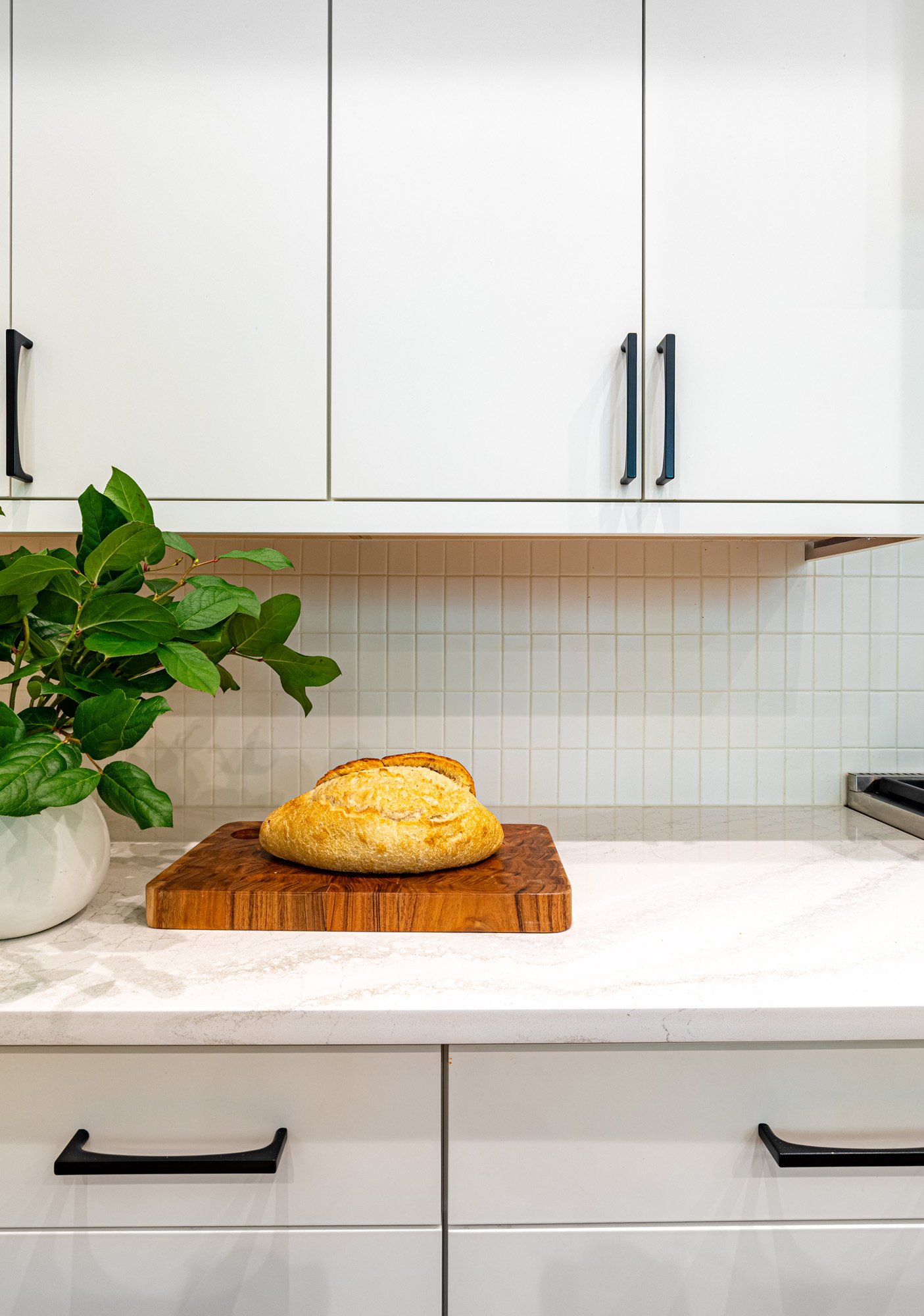 Lincoln Park, Chicago modern kitchen countertop detail designed by Wendy Nobriga Interiors showcasing custom cabinetry, quartz countertops, and thoughtful styling.