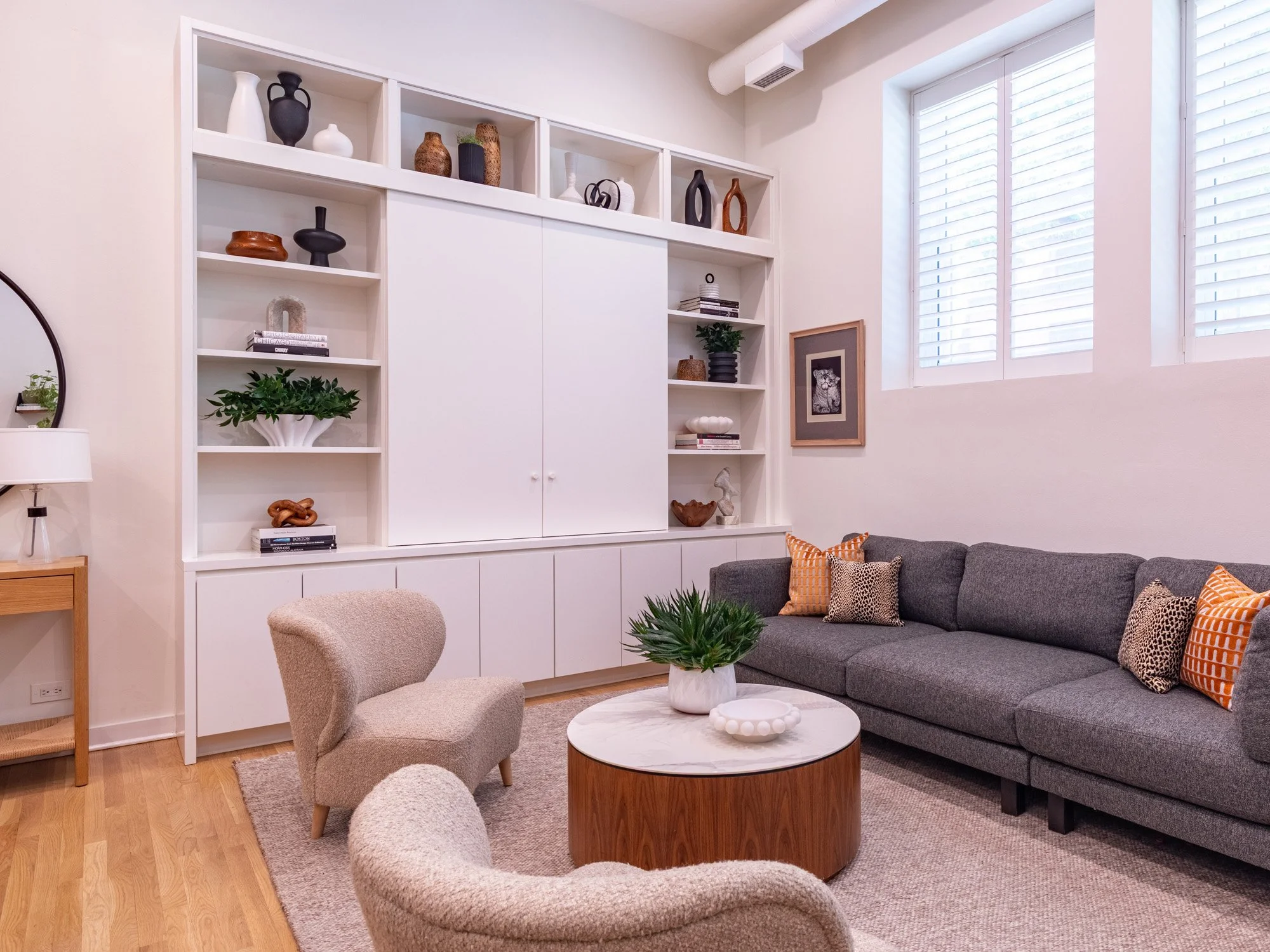 Lincoln Park, Chicago modern living room designed by Wendy Nobriga Interiors featuring a custom media wall, contemporary furnishings, and an open layout ideal for relaxing and entertaining.