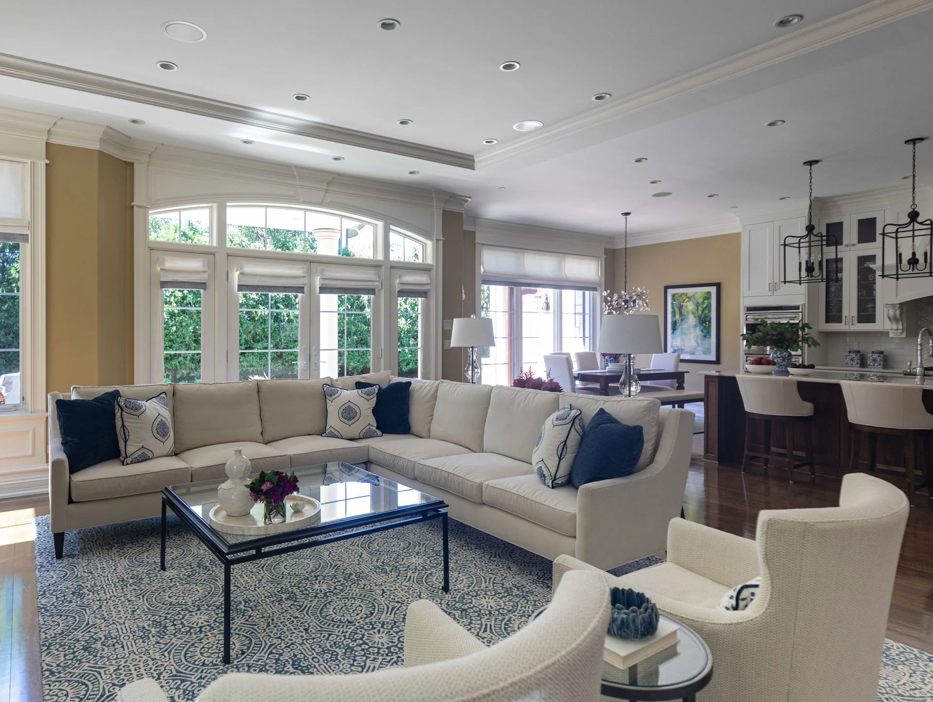 Lincolnwood IL family room with sectional sofa open to kitchen and dining area designed by Wendy Nobriga Interiors