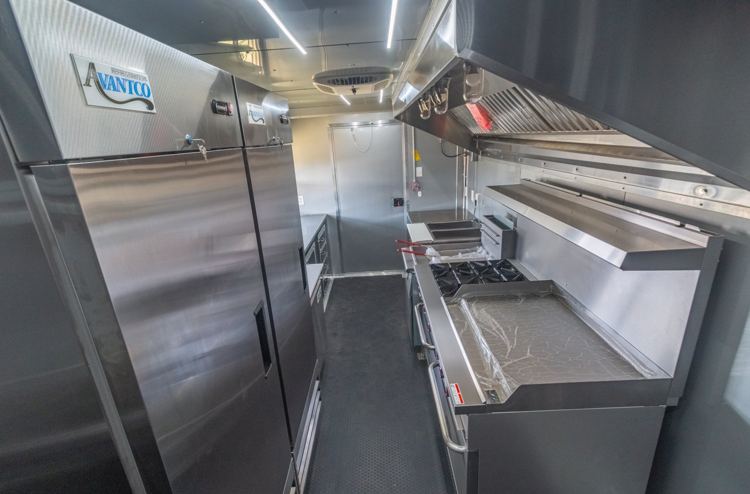 Custom Trailer Pros - black food trailer with large porch on rear Vin 82878-39.jpg