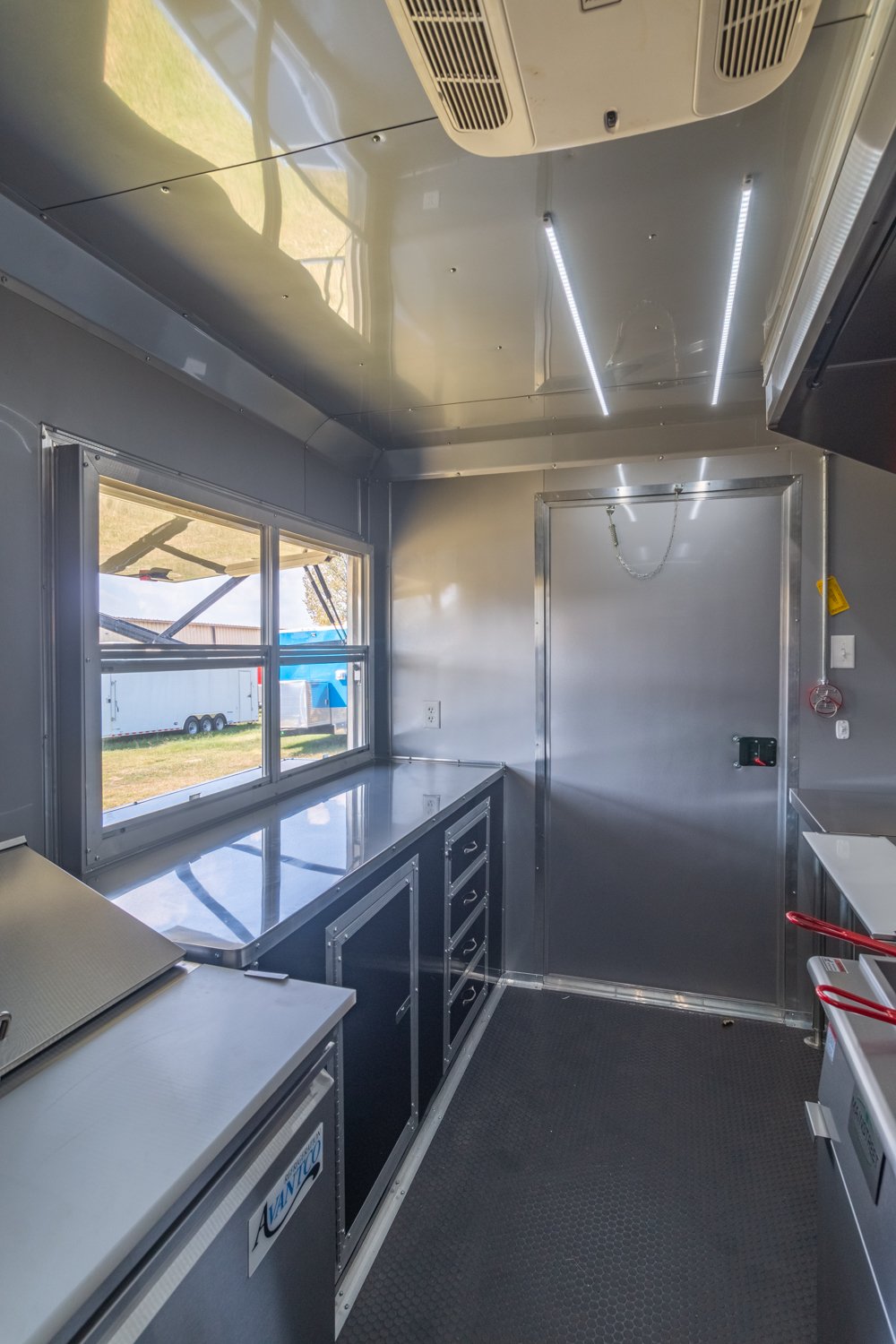 Custom Trailer Pros - black food trailer with large porch on rear Vin 82878-35.jpg