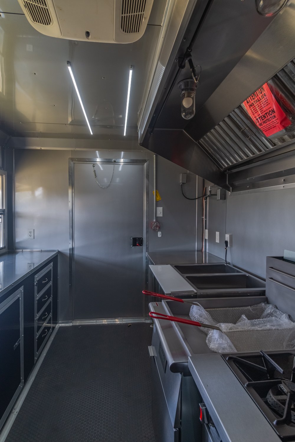 Custom Trailer Pros - black food trailer with large porch on rear Vin 82878-34.jpg