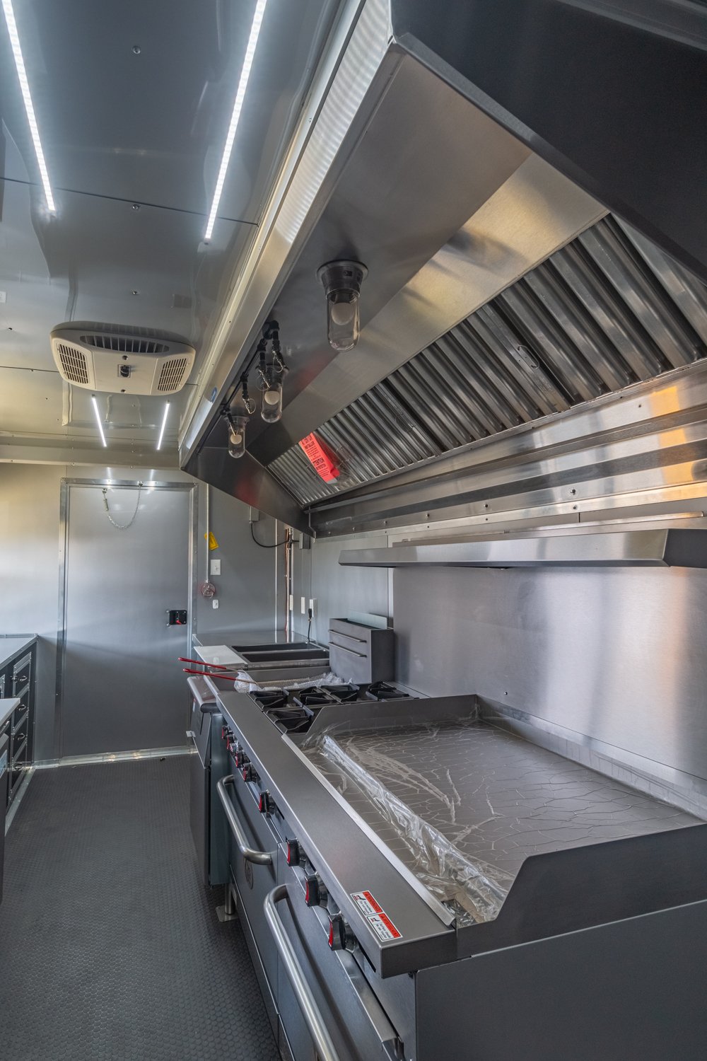 Custom Trailer Pros - black food trailer with large porch on rear Vin 82878-31.jpg