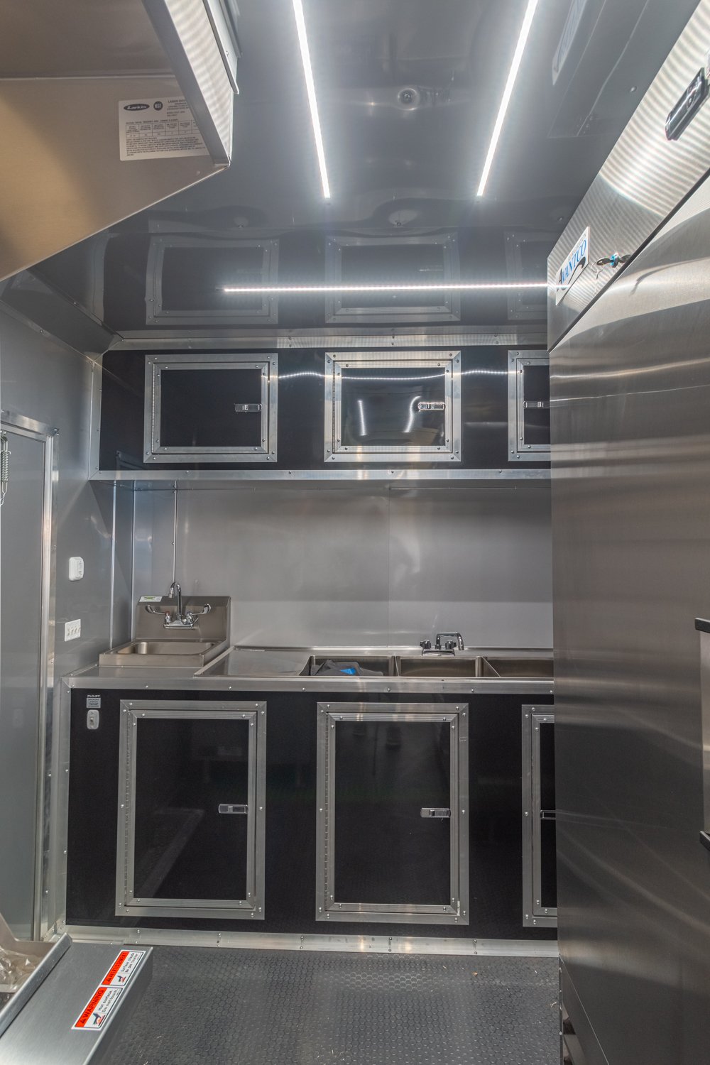 Custom Trailer Pros - black food trailer with large porch on rear Vin 82878-28.jpg