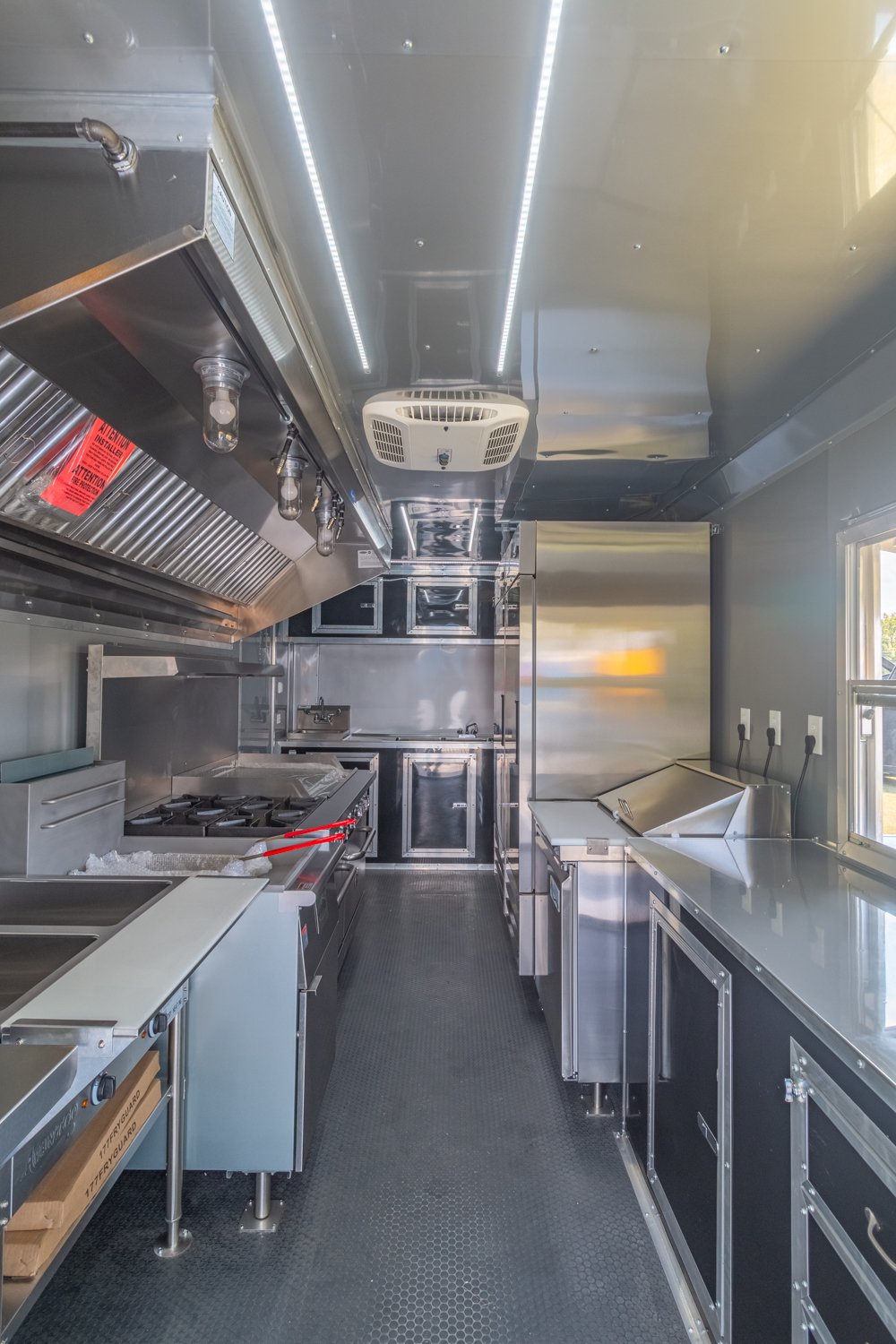 Custom Trailer Pros - black food trailer with large porch on rear Vin 82878-24.jpg