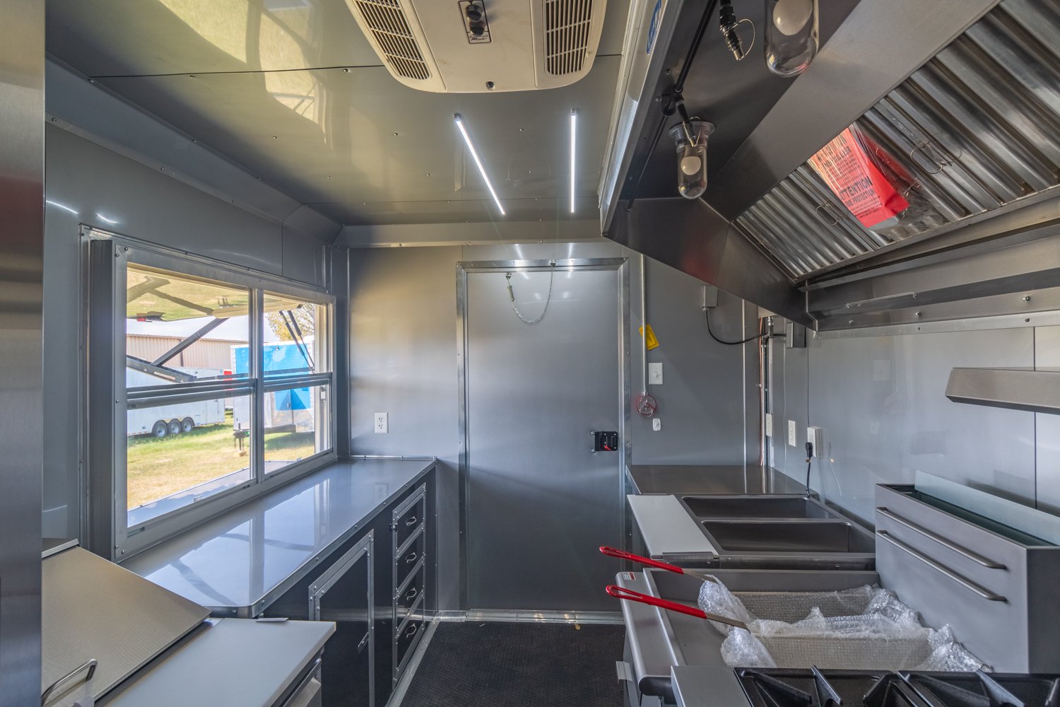 Custom Trailer Pros - black food trailer with large porch on rear Vin 82878-22.jpg