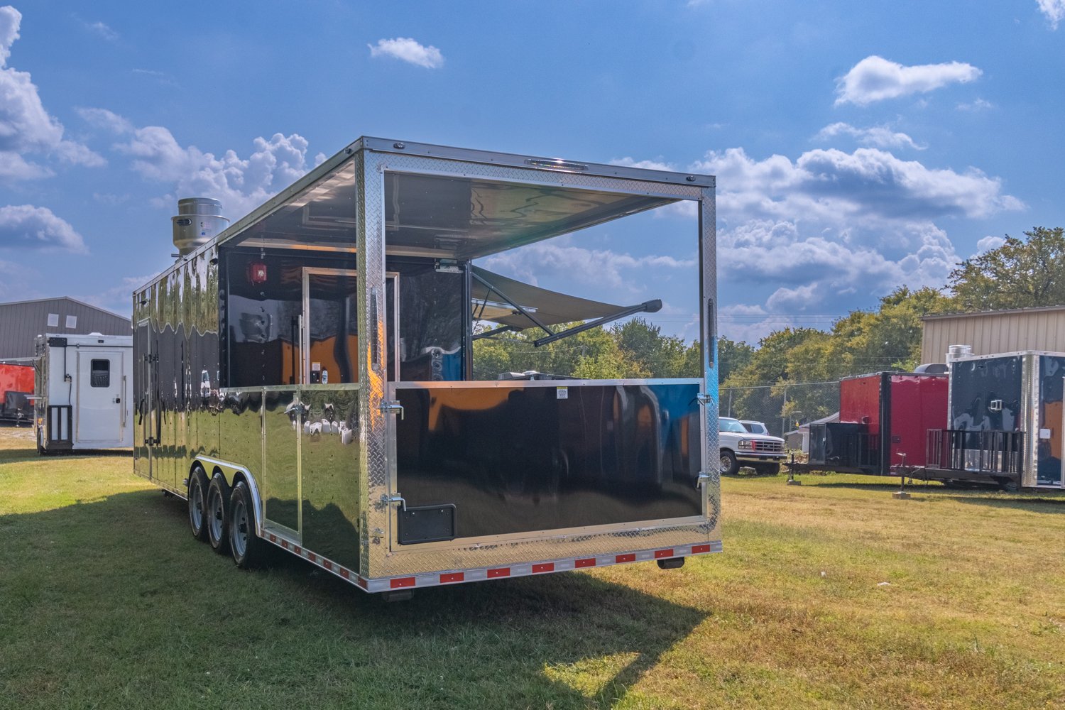 Custom Trailer Pros - black food trailer with large porch on rear Vin 82878-8.jpg