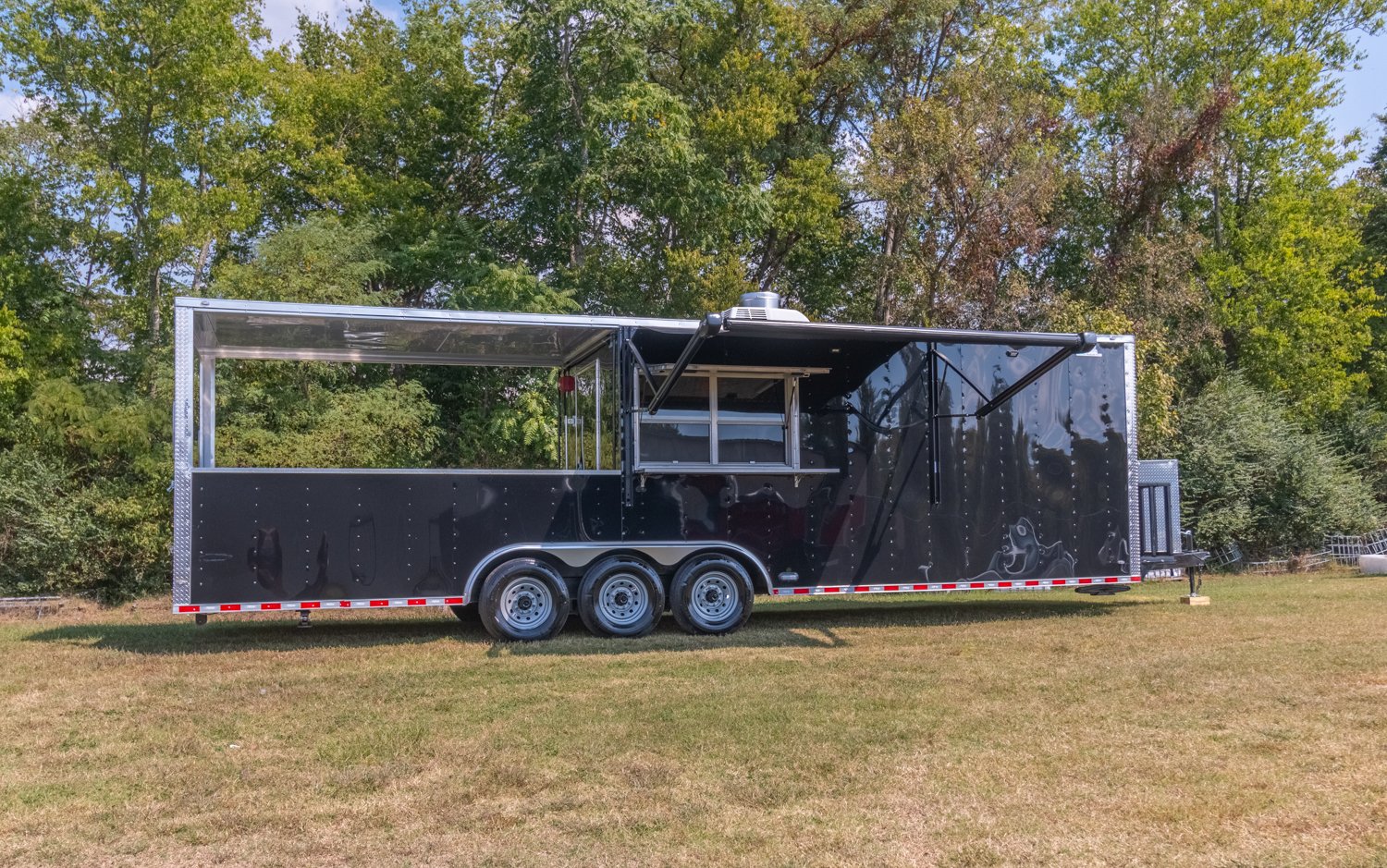 Custom Trailer Pros - black food trailer with large porch on rear Vin 82878-2.jpg