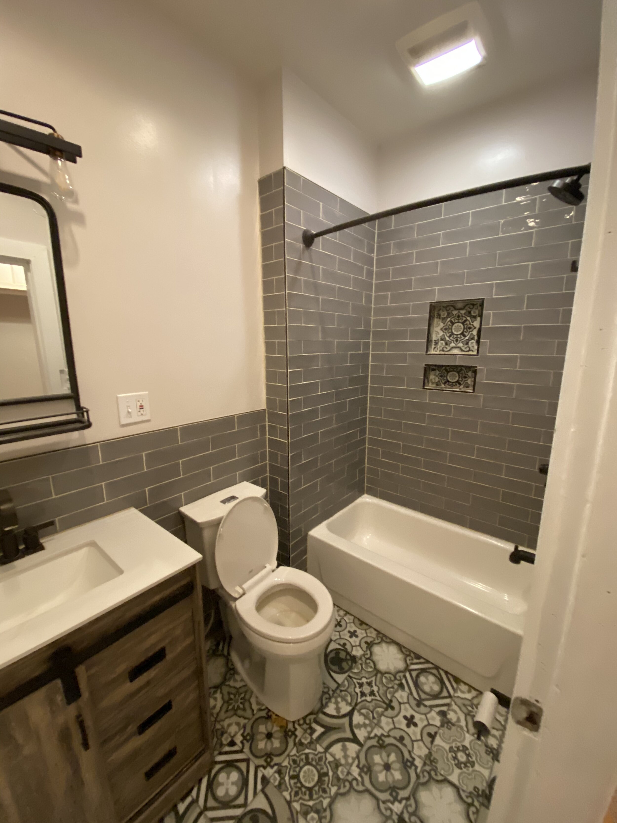  No before photos on this one, oops. This was previously a half bath adjacent with a full guest bath.  We flipped the two so that the full bath was in a master bedroom.  A small bathroom called for a micro tub (50” instead of 60”).  Fun mosaic print 