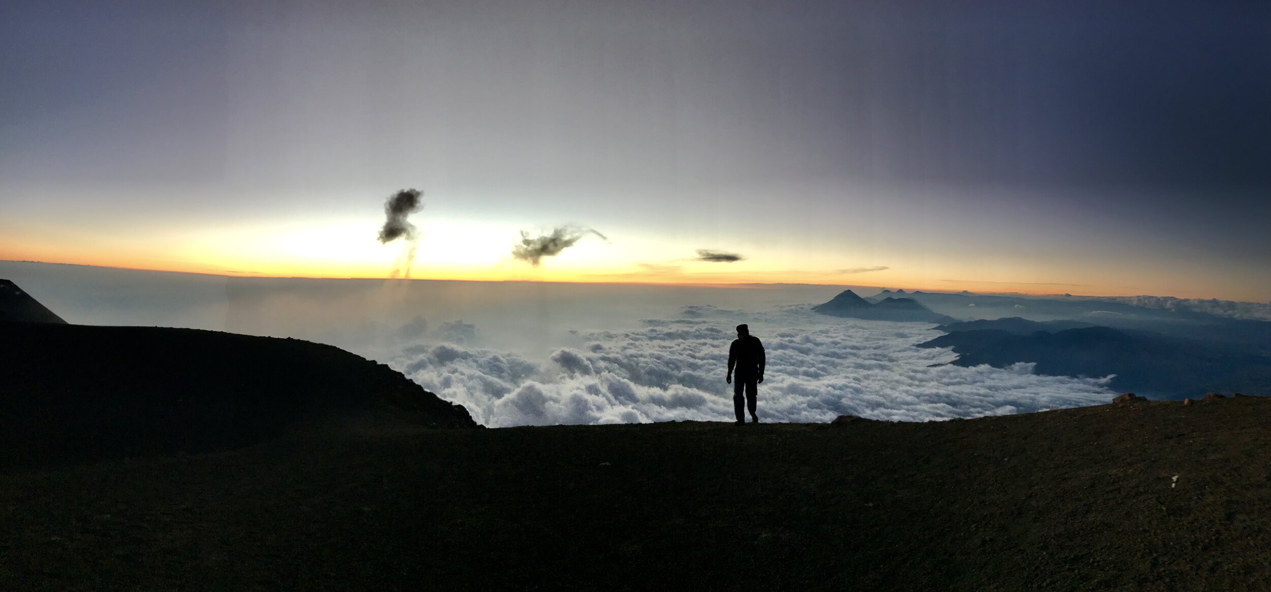  Nearing the summit of Vulcan Acetanango in Guatemala.  This is my brother as we approached the summit to watch adjacent Vulcan Fuego erupt at night, the lava explosion visible as it cascades down the slopes.  We then trail ran the entire mountain ba