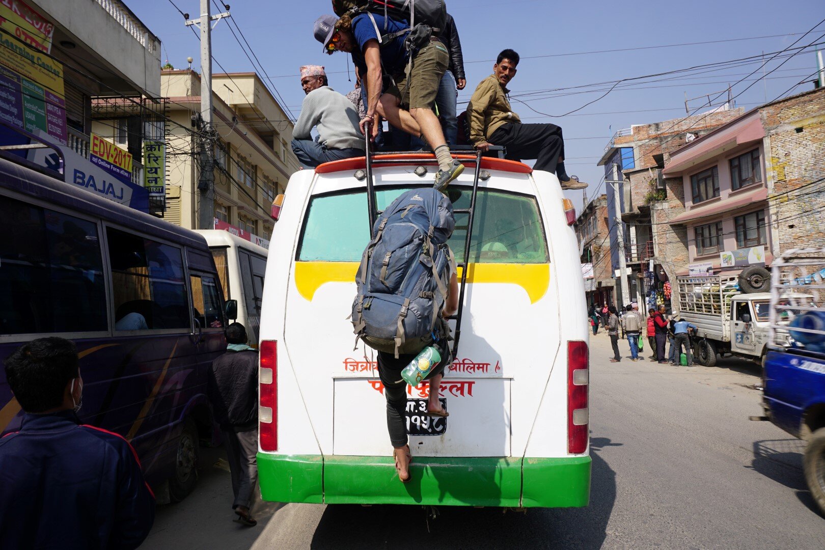  Climbing atop a bus during the fuel crisis in Nepal, post Earthquake 2015. We were taking a bus out to a village near Kathmandu with some sport climbing.  