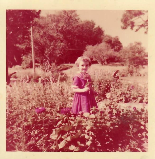 Here I am in my Betsy McCall dress in Mom’s garden.