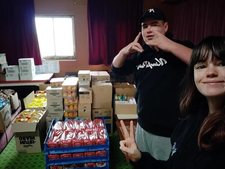 Hayden Cleghorn and Elicia Keating – Greymouth Future Leaders  Greymouth Future Leaders preparing Care Hampers for their community – special thanks to Bidfoods and The Shed.