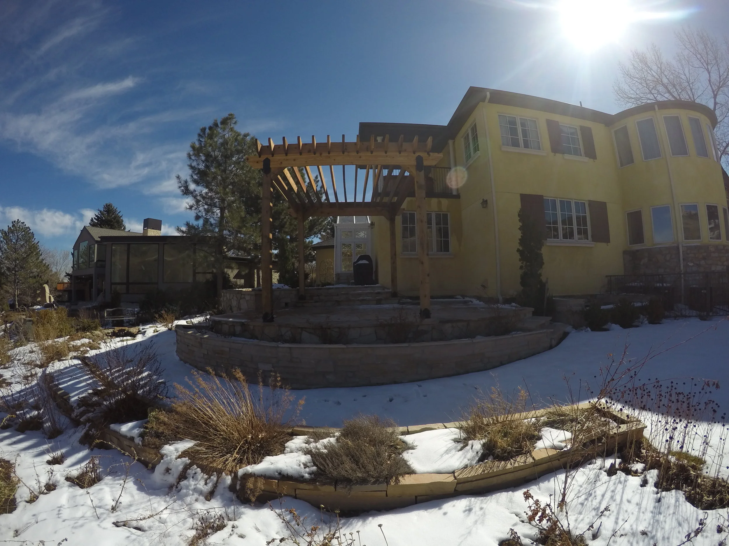 open backyard with wooden pergola