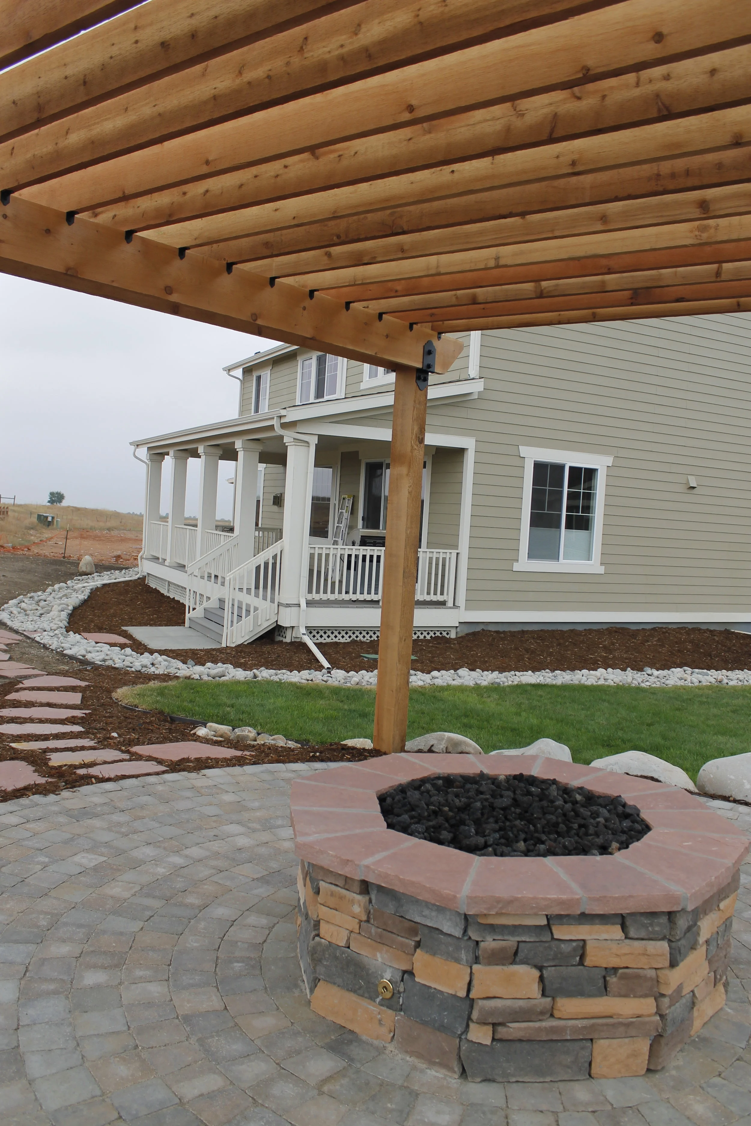 paver patio with stone fire pit