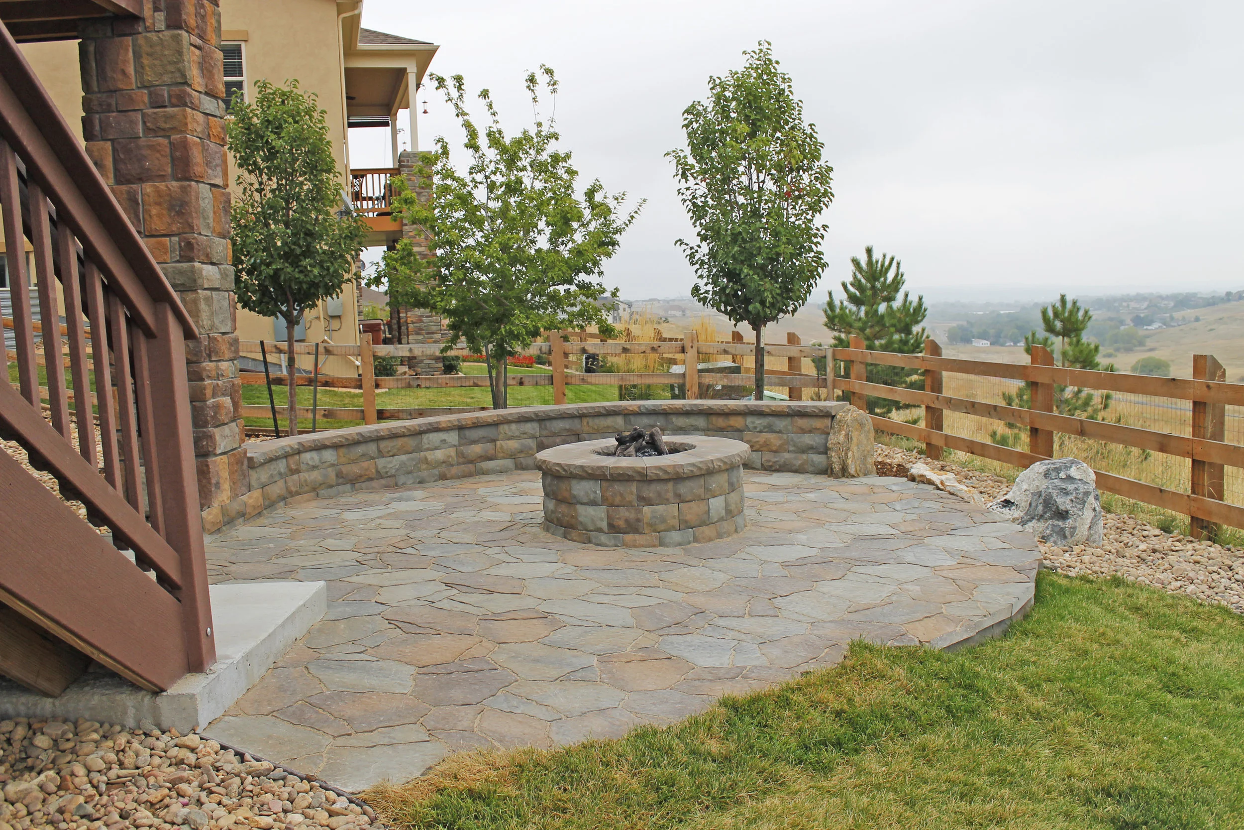 custom stone patio and fire pit