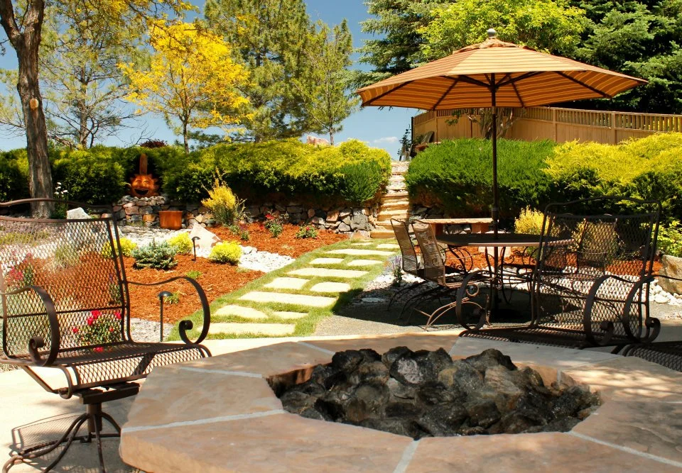 beautiful backyard renovation with fire pit